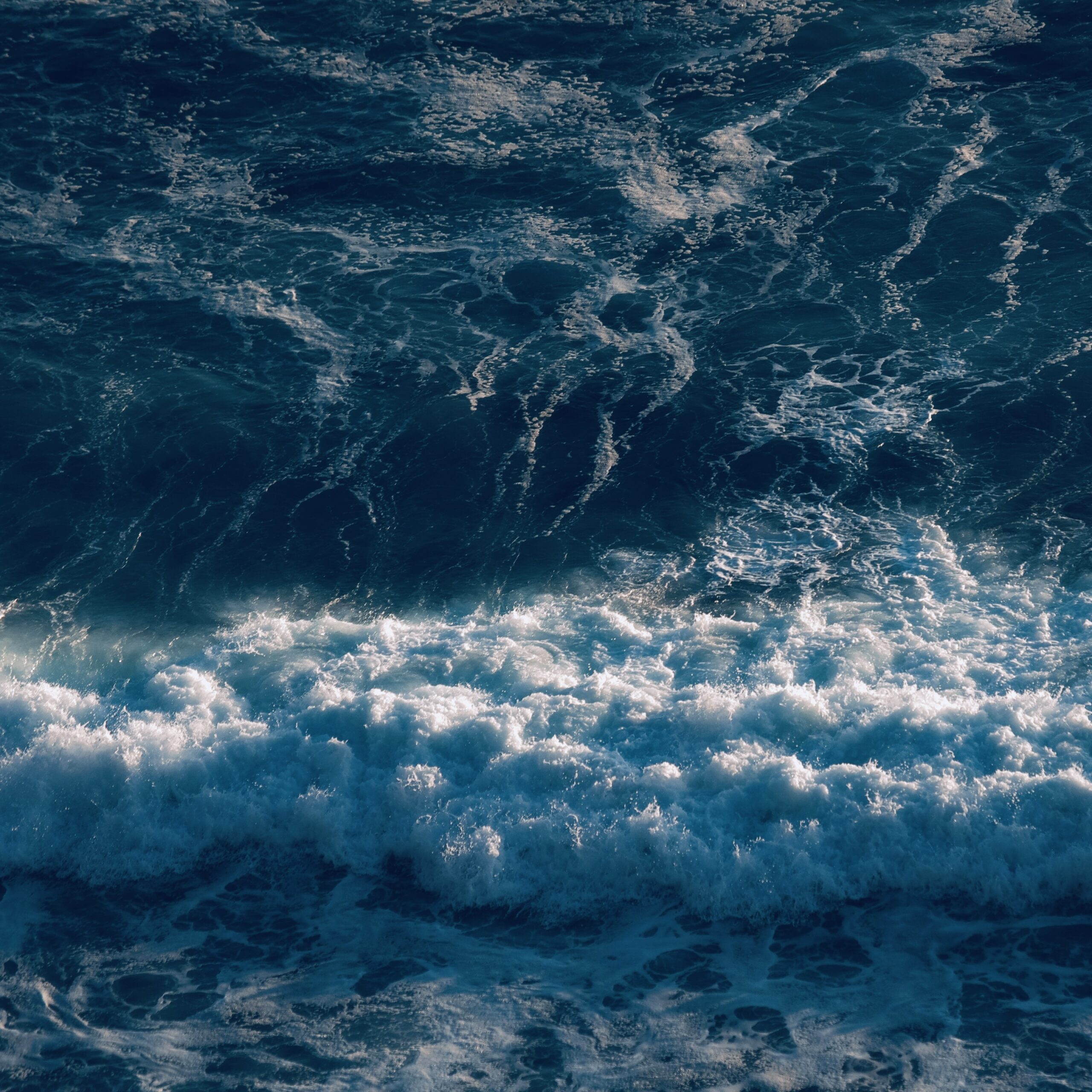 Close up of tidal ocean waves.