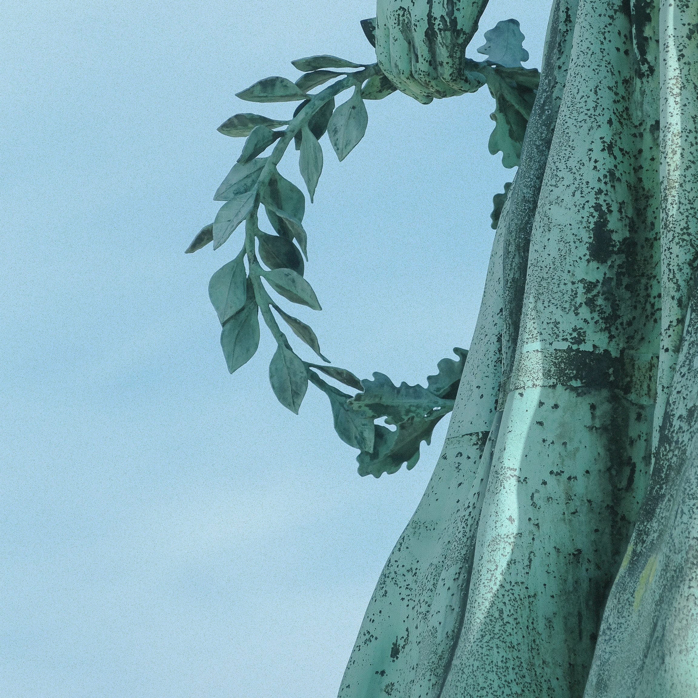 Laurel wreath held by statue