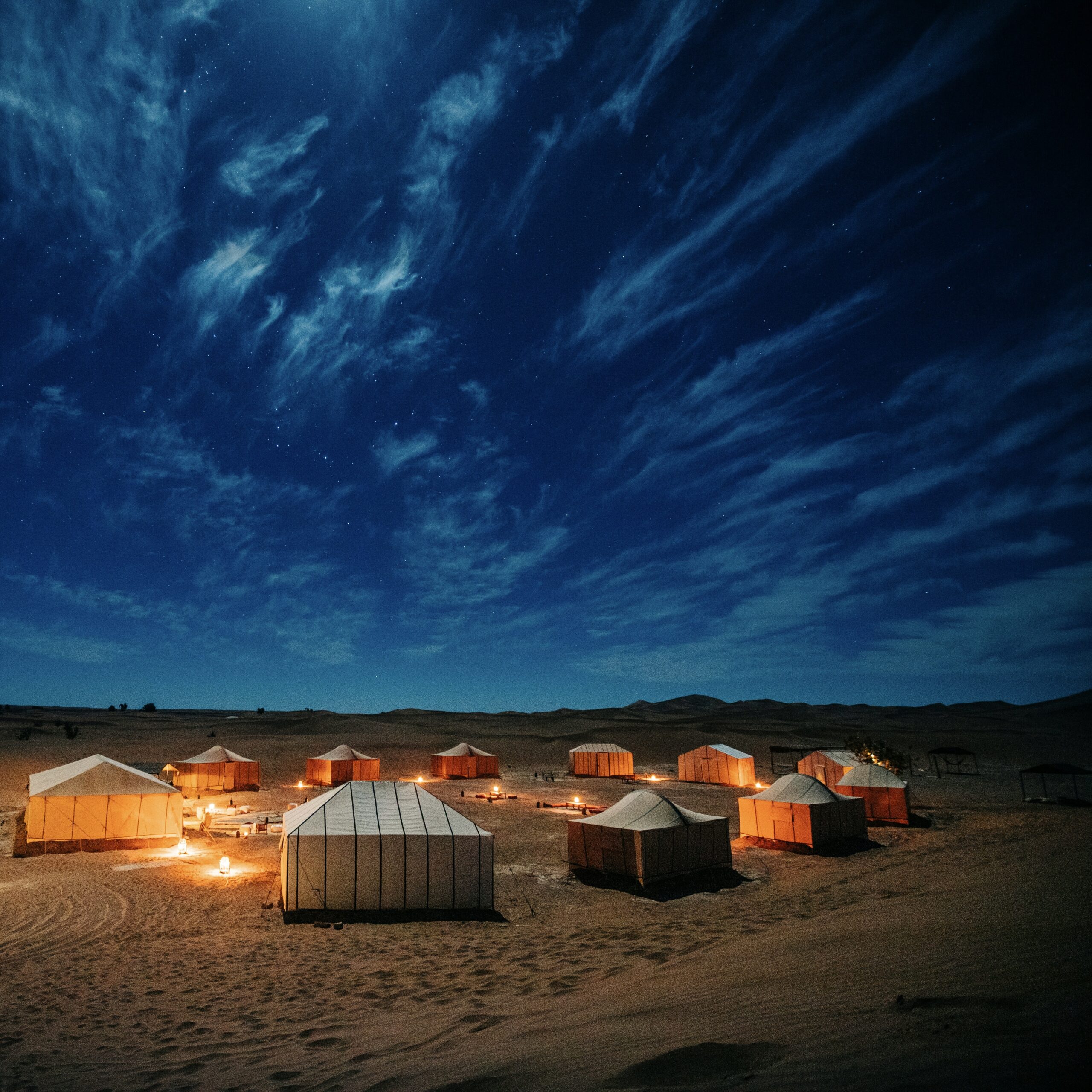Bright blue night sky in the desert, canvas tent circle